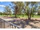 Scenic view of the golf course beyond the backyard, offering lush greenery and mature trees at 3146 Bel Air Dr, Las Vegas, NV 89109