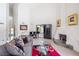 Bright living room featuring high ceilings, fireplace, and a black grand piano at 3146 Bel Air Dr, Las Vegas, NV 89109