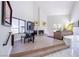 Bright, open living room featuring a fireplace, large windows and direct access to the yard at 3146 Bel Air Dr, Las Vegas, NV 89109