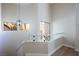 Elegant staircase featuring glass railing and a modern pendant light at 3146 Bel Air Dr, Las Vegas, NV 89109