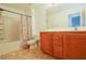 Bathroom with tiled floor, vanity, and bathtub at 3921 Buteo Ln, North Las Vegas, NV 89084