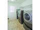 Laundry room with washer, dryer, and shelving at 3921 Buteo Ln, North Las Vegas, NV 89084