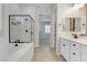 Bathroom with double vanity and large mirror at 54 Barton Bay Ave, North Las Vegas, NV 89031