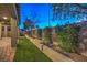 Landscaped backyard with artificial turf and sitting walls at 5433 Strawberry Swing St, North Las Vegas, NV 89081