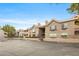 Tan two-story building with parking lot and stairway access at 700 Capri Dr # 30C, Boulder City, NV 89005