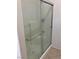 Clean shower with sliding glass doors and metal grab bars at 7709 Island Rail Dr, North Las Vegas, NV 89084