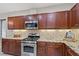 Kitchen with granite countertops and stainless steel appliances at 8027 Carr Valley St, Las Vegas, NV 89131