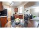 Dining area with glass table and chairs, kitchen view at 2120 Ramrod Ave # 1112, Henderson, NV 89014