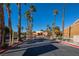 Community entrance with gated access and palm trees at 2120 Ramrod Ave # 1112, Henderson, NV 89014