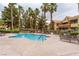 Inviting pool with lounge chairs, palm trees, and a relaxing atmosphere at 2120 Ramrod Ave # 1112, Henderson, NV 89014