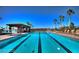 Outdoor community swimming pool with lap lanes and lounge chairs, with a shaded area at 305 Via Del Duomo, Henderson, NV 89011