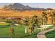 Scenic golf course community with desert landscape and mountain views in the background at 305 Via Del Duomo, Henderson, NV 89011