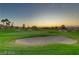 Picturesque golf course view at sunset showcasing lush green fairways and mature trees at 305 Via Del Duomo, Henderson, NV 89011