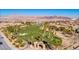 Scenic view of the Chimera Golf Club with well-manicured greens, set against a backdrop of mountains at 305 Via Del Duomo, Henderson, NV 89011