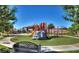 Community playground with multiple play structures and a comfortable seating area for families at 305 Via Del Duomo, Henderson, NV 89011