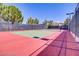 Outdoor tennis court with professional surfacing and lighting, perfect for recreational games and practice at 305 Via Del Duomo, Henderson, NV 89011