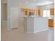 Well-equipped kitchen with an island, connecting to the living area, and plenty of natural light at 3591 Driving Range St, Las Vegas, NV 89122