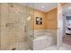 Spa-like bathroom with a large soaking tub and glass shower at 4471 Dean Martin Dr # 3908, Las Vegas, NV 89103