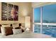 Bedroom with large windows offering stunning city views at night at 4471 Dean Martin Dr # 3908, Las Vegas, NV 89103