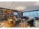 Elegant library with fireplace, seating and large screen TV at 4471 Dean Martin Dr # 3908, Las Vegas, NV 89103