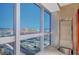 High floor condo with city views, hardwood floors, and modern glass dining table at 4471 Dean Martin Dr # 3908, Las Vegas, NV 89103