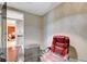 Home office with glass desk, red leather chair, and modern decor at 4471 Dean Martin Dr # 3908, Las Vegas, NV 89103