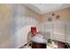Home office with glass desk, red leather chair, and modern decor at 4471 Dean Martin Dr # 3908, Las Vegas, NV 89103