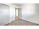 Bright bedroom with carpet flooring and mirrored closet doors at 617 Carpenter Dr, Las Vegas, NV 89107