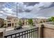 View of the street with houses, parked cars, and cloudy sky at 177 Almond Ridge Pl, Henderson, NV 89015