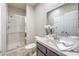 Clean bathroom with shower, vanity, and tiled flooring at 18 Tarryall Ter, Henderson, NV 89074