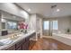 Elegant bathroom with a soaking tub and double vanity at 18 Tarryall Ter, Henderson, NV 89074