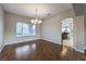 Dining room with hardwood floors and chandelier at 18 Tarryall Ter, Henderson, NV 89074