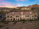 Luxury townhouses with tile roofs at sunset at 20 Via Visione # 104, Henderson, NV 89011