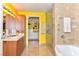 Bright bathroom with double sink vanity, soaking tub, and walk-in closet at 200 W Sahara Ave # 601, Las Vegas, NV 89102