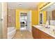 Bathroom boasting tiled walls, soaking tub, and double sink vanity at 200 W Sahara Ave # 601, Las Vegas, NV 89102
