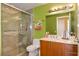Bathroom with glass shower, vanity and stone tile surround at 200 W Sahara Ave # 601, Las Vegas, NV 89102