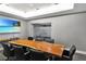 Spacious conference room featuring a large live edge table and seating for ten with a wall-mounted display at 200 W Sahara Ave # 601, Las Vegas, NV 89102