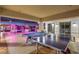 An inviting game room, with a ping pong and pool table, is set against a backdrop of illuminated trees at 200 W Sahara Ave # 601, Las Vegas, NV 89102