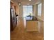 Kitchen showcases stainless steel appliances, a breakfast bar island with dark countertop, and tile flooring at 200 W Sahara Ave # 601, Las Vegas, NV 89102