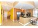 Modern kitchen features wood cabinets, stainless steel appliances, and a breakfast bar with stools at 200 W Sahara Ave # 601, Las Vegas, NV 89102