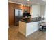 Modern kitchen features stainless steel appliances, granite countertops and breakfast bar with seating at 200 W Sahara Ave # 601, Las Vegas, NV 89102