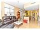 Open living space with leather sofas, tile floors, and a view of the adjacent kitchen area at 200 W Sahara Ave # 601, Las Vegas, NV 89102