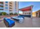 Upscale poolside lounge with outdoor kitchen, modern seating, and shade structure at 200 W Sahara Ave # 601, Las Vegas, NV 89102