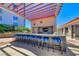 Stylish outdoor bar with seating and a chef's kitchen, perfect for outdoor entertaining at 200 W Sahara Ave # 601, Las Vegas, NV 89102