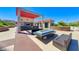 Stylish poolside seating area with outdoor kitchen, bar and modern furniture at 200 W Sahara Ave # 601, Las Vegas, NV 89102