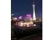 Nighttime view of modern fire pit and lounge seating near pool and Stratosphere at 200 W Sahara Ave # 601, Las Vegas, NV 89102