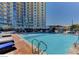 Relaxing pool area with clear water, lounge chairs, and lush landscaping, perfect for enjoying sunny days in style at 200 W Sahara Ave # 601, Las Vegas, NV 89102