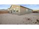 Spacious backyard with gravel and view of home exterior at 2051 Hunt Woods Ct, Laughlin, NV 89029