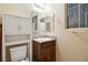 Clean bathroom with vanity, toilet and overhead cabinet at 2051 Hunt Woods Ct, Laughlin, NV 89029