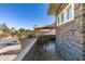 Enjoy the scenery from this private balcony with stone accents and outdoor seating at 2817 High View Dr, Henderson, NV 89014